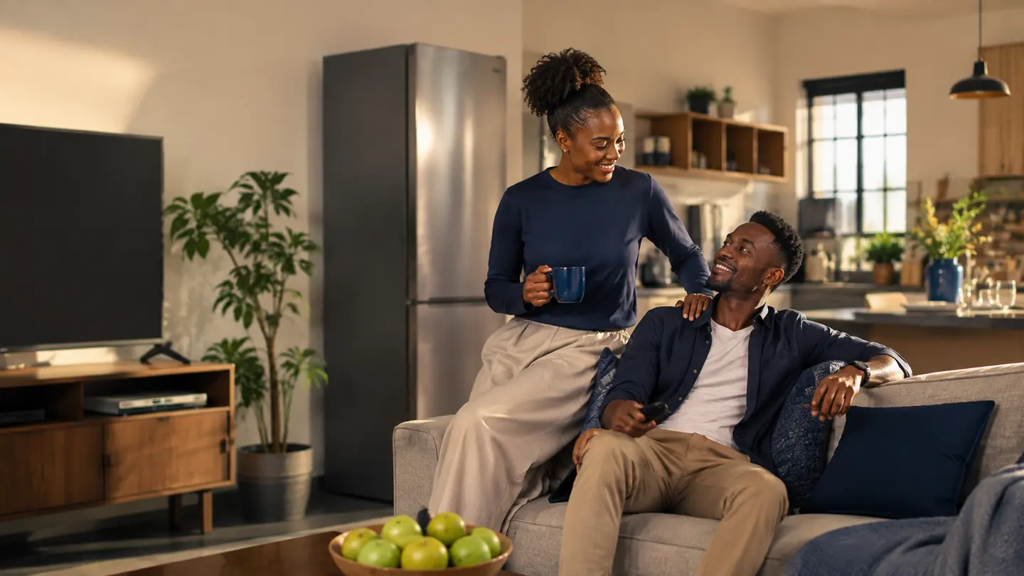 African couple at home with modern household essentials